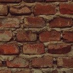 Una vista de cerca de una pared de ladrillos rojos con mortero visible entre los ladrillos.