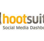 Un logotipo de búho estilizado con ojos grandes, junto a una forma rectangular en colores naranja y gris.