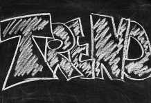La palabra "TREND" está escrita en letras grandes, similares a las de tiza, sobre un fondo de pizarra.